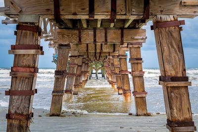 Pier over sea against sky