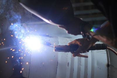 Man working on illuminated stage