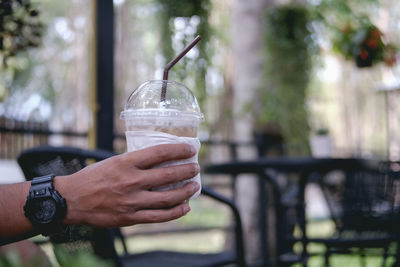 Close-up of hand holding drink