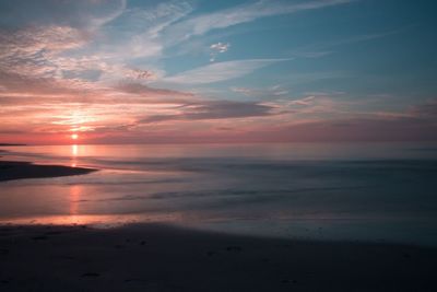 Scenic view of sea at sunset