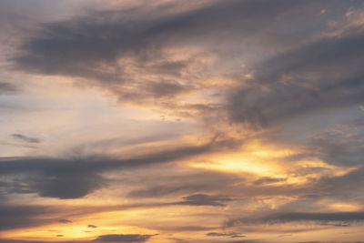 Low angle view of dramatic sky during sunset