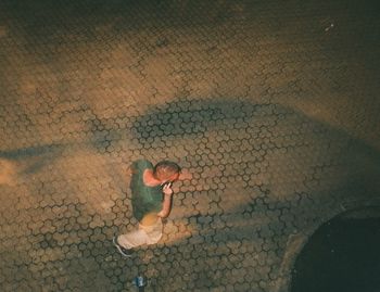 High angle view of woman shadow on street