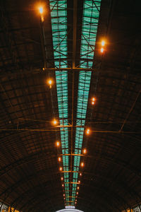 Low angle view of illuminated lights at night