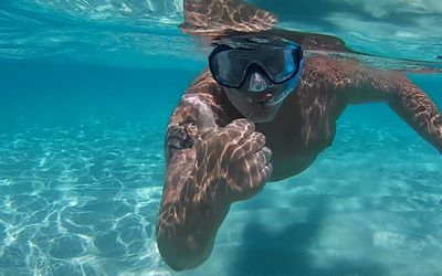 Woman swimming in sea