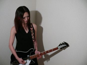 Young woman playing guitar