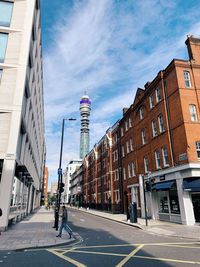 City street and buildings against sky