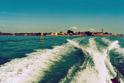 Scenic view of sea against clear blue sky