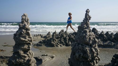 Girl walking on beach