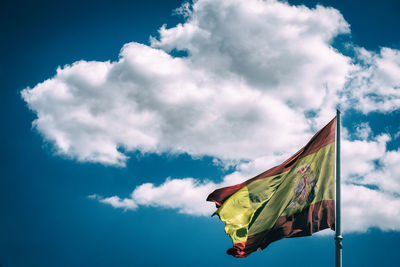 Low angle view of flag against sky