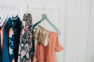 Close-up of clothes hanging on rack at home