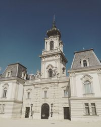 Low angle view of bell tower against sky