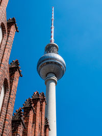 Low angle view of buildings against blue sky