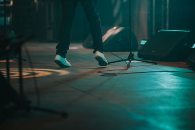 Low section of man standing on stage