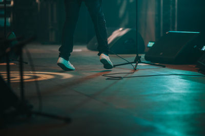 Low section of man standing on stage