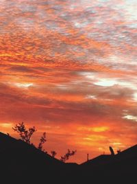 Scenic view of dramatic sky at sunset