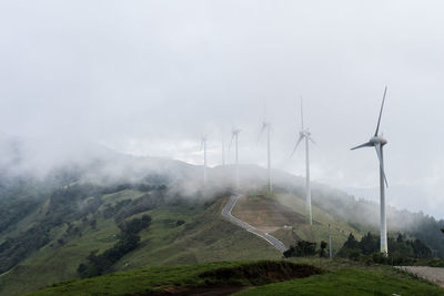 Scenic view of agricultural landscape against sky