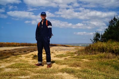 Rear view of man standing on field