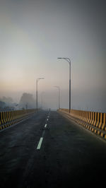 Empty road against clear sky