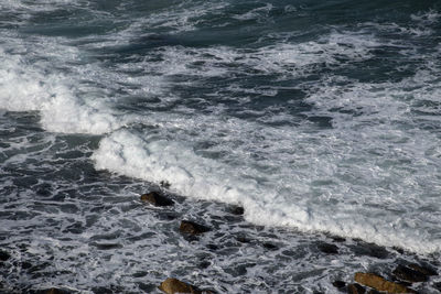High angle view of waves in sea