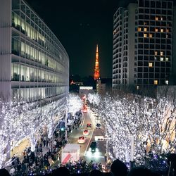 High angle view of people on city street at night