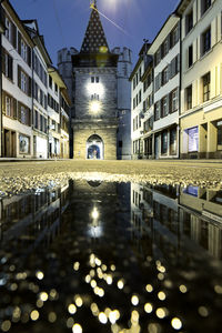 Reflection of illuminated buildings in canal at night