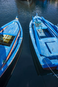 High angle view of boats moored in lake