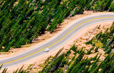 Aerial view of car moving on road