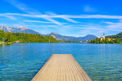 Scenic view of lake against blue sky