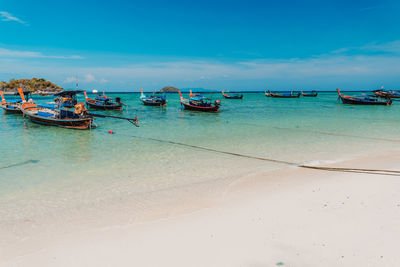 Scenic view of beach against blue sky