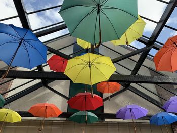 Low angle view of umbrellas hanging on ceiling