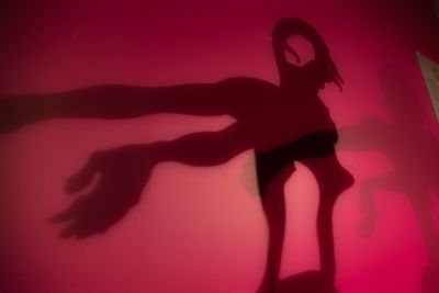 Close-up of woman relaxing on wall