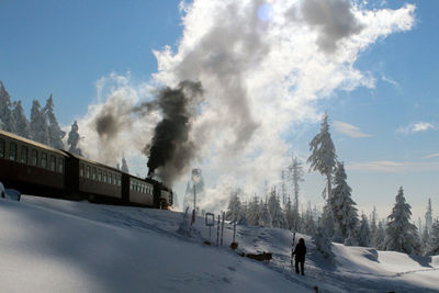 Panoramic view of snow covered mountain against sky