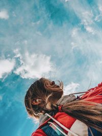 Low angle view of woman against sky