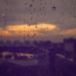 Full frame shot of raindrops on window