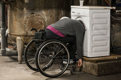 Man sitting in old cart