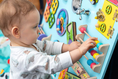 Close-up of boy playing with toy blocks