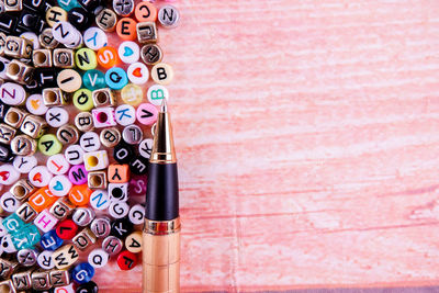 Directly above shot of pen and letters on table