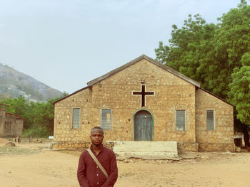 A man in front of a local church