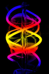 Close-up of light painting against black background