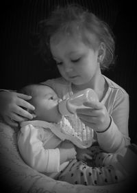 Close-up of baby holding baby