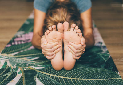 Woman doing yoga on a yoga mat