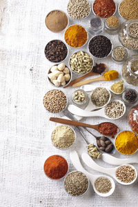 Close-up of various spices in spoons on table