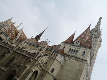 Low angle view of buildings against sky in city