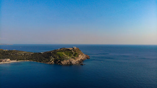 Scenic view of sea against clear blue sky