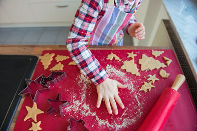 High angle view of woman preparing food on table