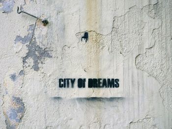 Close-up of text on wall