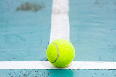 Close-up of tennis ball on court