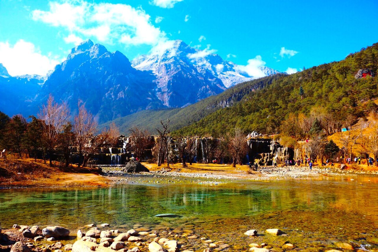 mountain, water, tranquil scene, lake, tranquility, scenics, tree, beauty in nature, sky, mountain range, nature, rock - object, reflection, non-urban scene, season, landscape, idyllic, blue, autumn, river