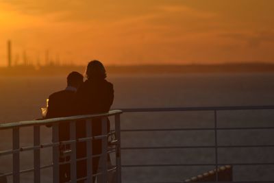 Couple on a cruise in sunset 