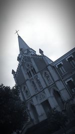 Low angle view of building against sky in city